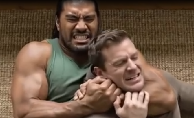 Clip from the advert depicting a man in a headlock